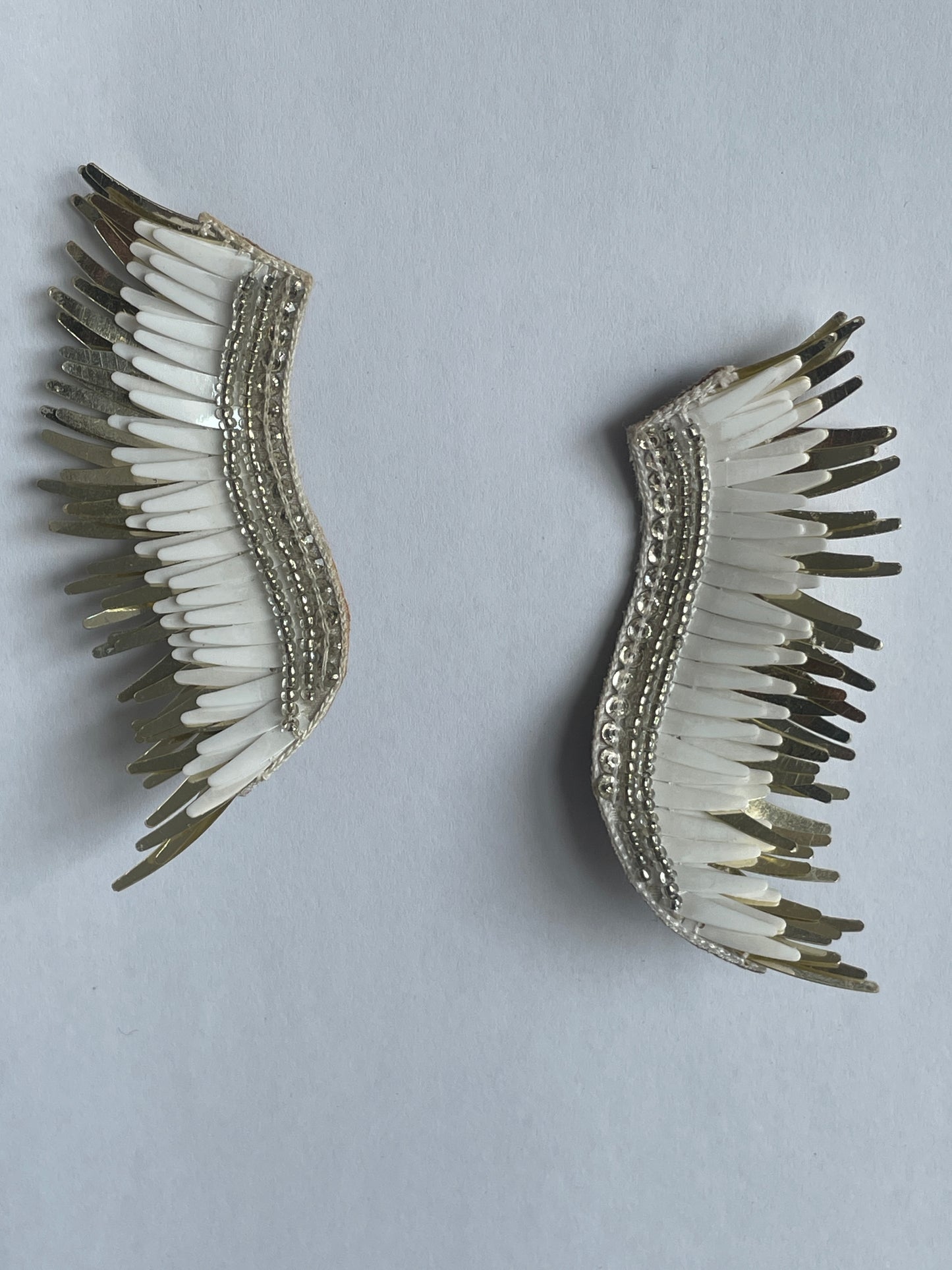 White wing sequinned studs