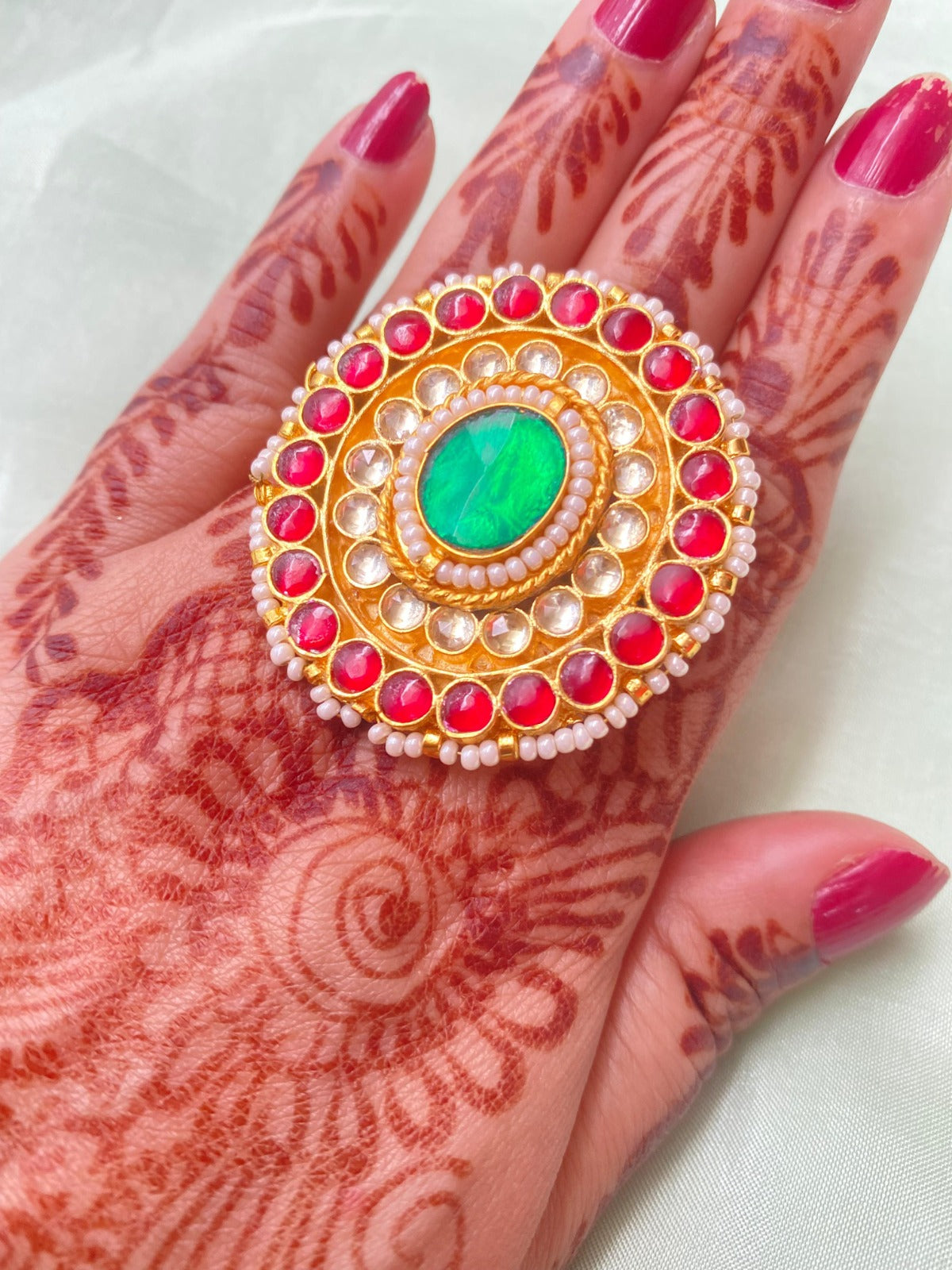 Gold Finish Kundan Ring with Red and Green Stones